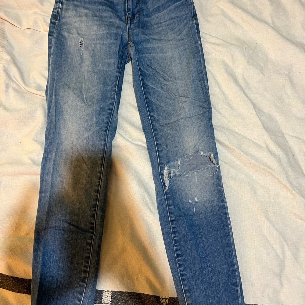 Distressed Blue Denim Jeans
